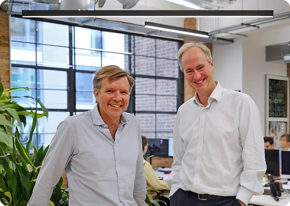 Liv-ex fine wine exchange platform founders smiling together in office